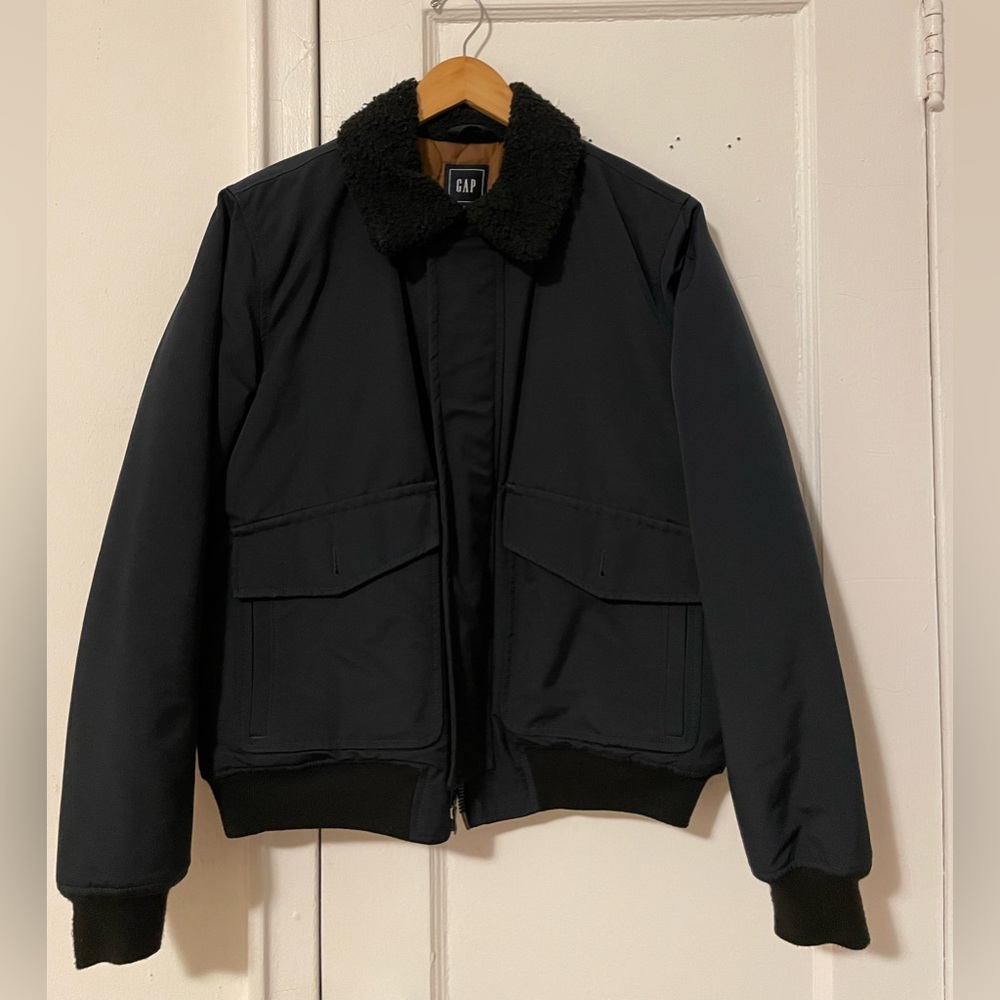 Medium size coat. Dark blue color